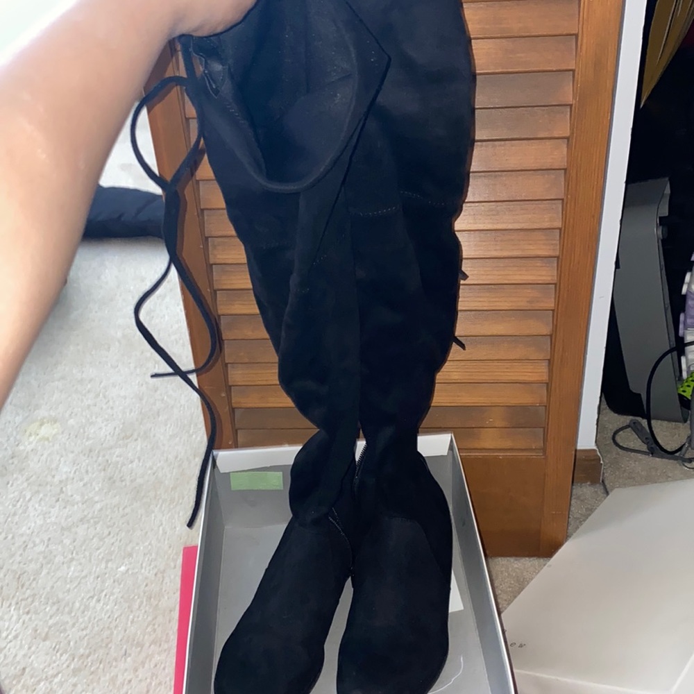 High knee boots.